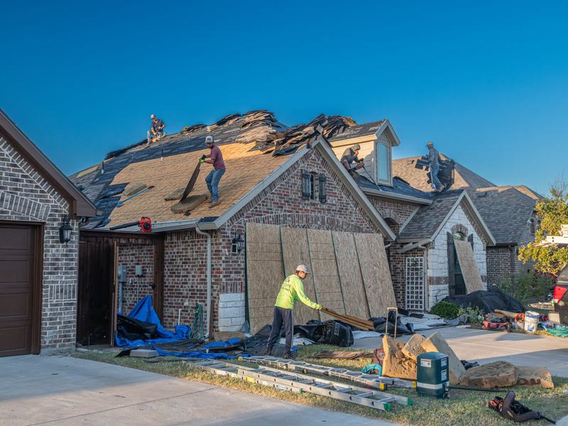 Roofing work on a home near Hudson, Iowa